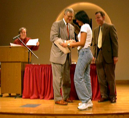 A man in graduation gown; Actual size=240 pixels wide